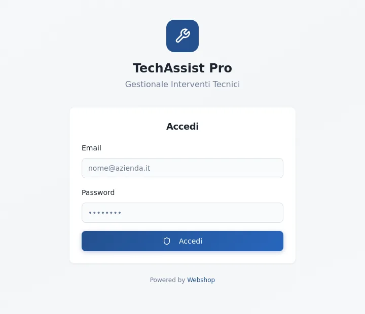 Schermata di accesso di TechAssist Pro, il gestionale degli interventi tecnici, con logo a chiave inglese e i campi email e password — software realizzato da Webshop Factory